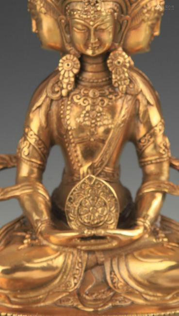 A TIBETAN BUDDHIST BRONZE ADJOIN 